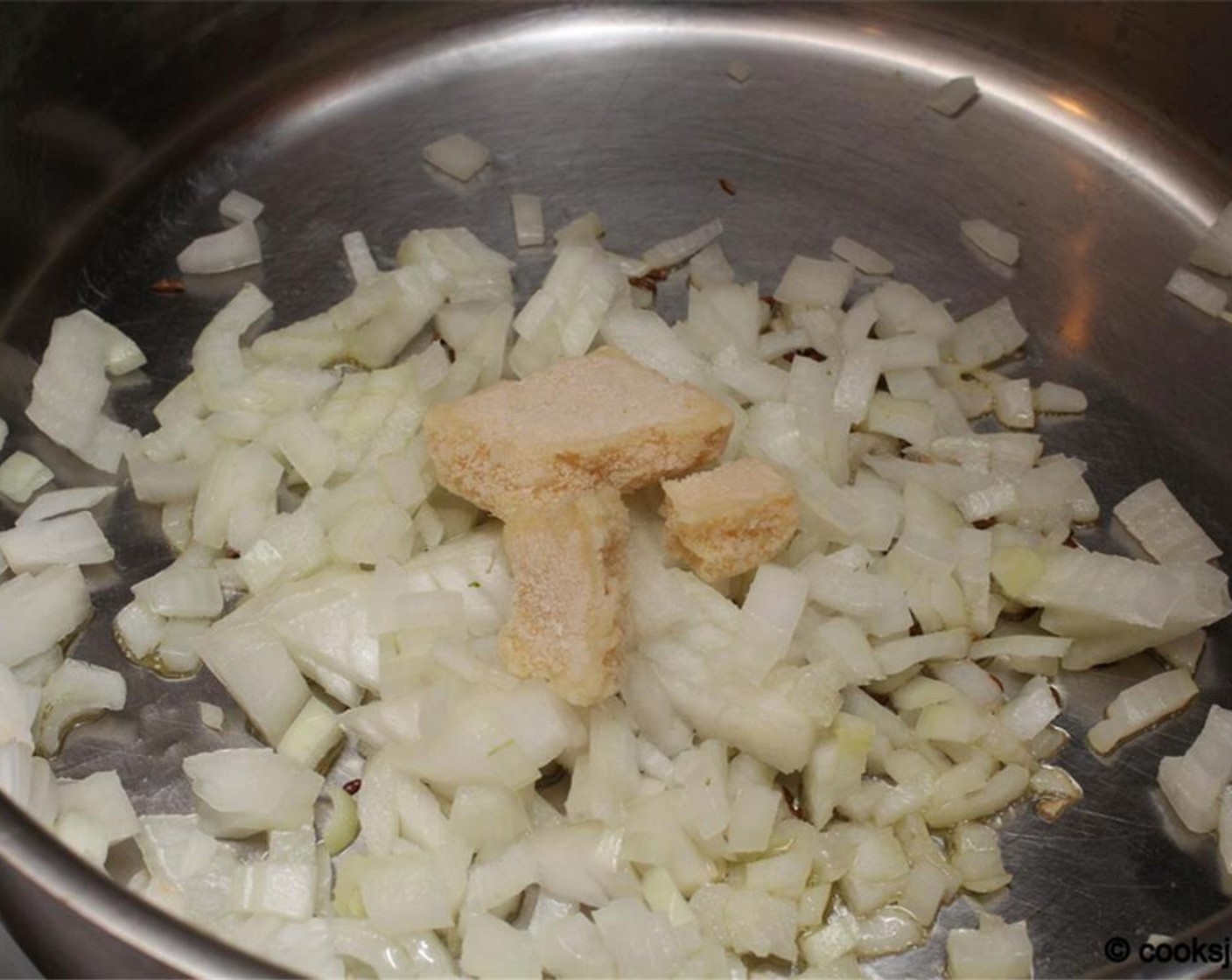 step 7 Add Onion (1 cup) and Ginger Garlic Paste (1/2 Tbsp).