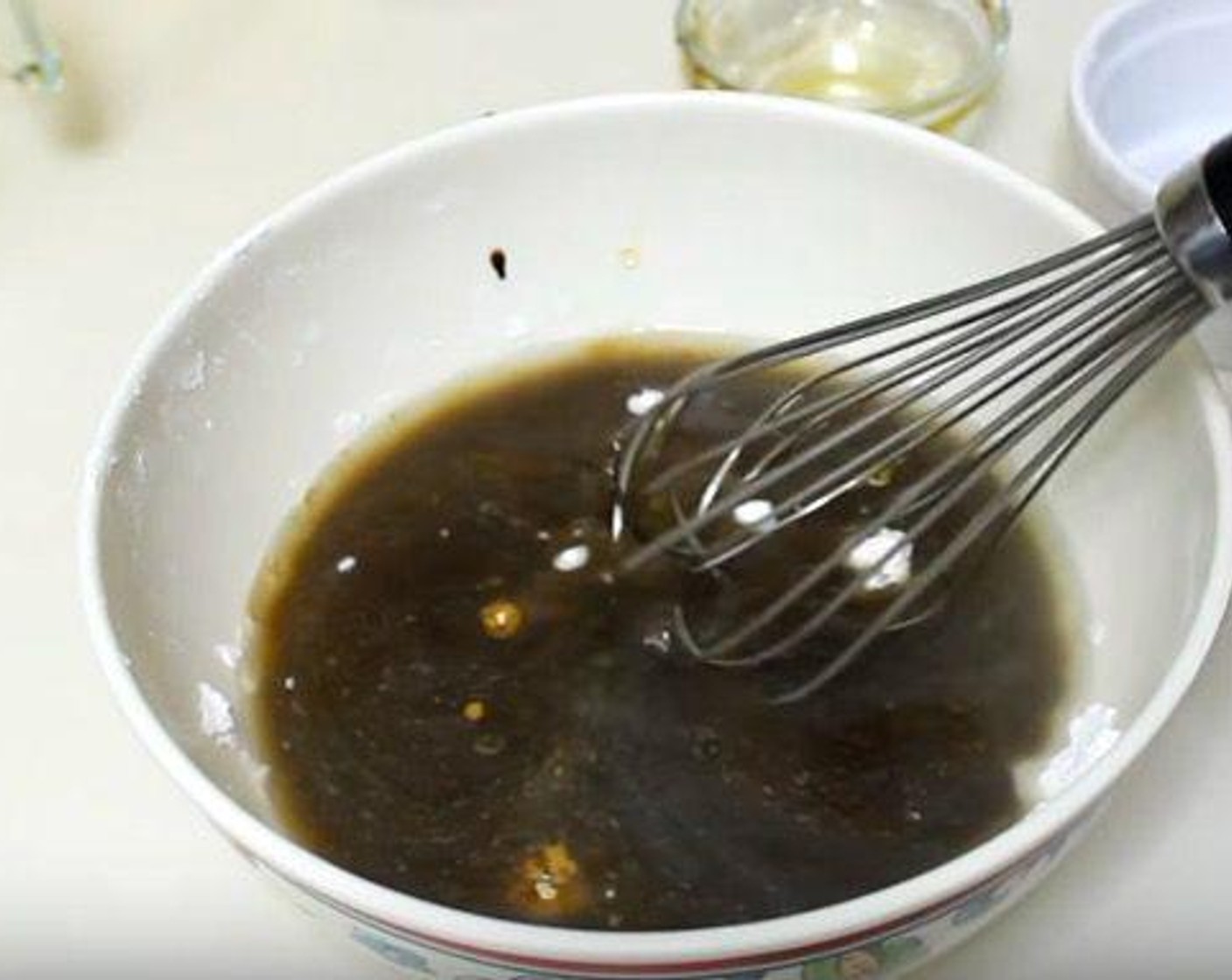 step 3 In the same bowl you had your chicken and flour, add Chicken Broth (1 cup), Garlic (2 cloves), Ground Ginger (1 tsp), Soy Sauce (1/4 cup), and Honey (3 Tbsp). Whisk together and set aside.