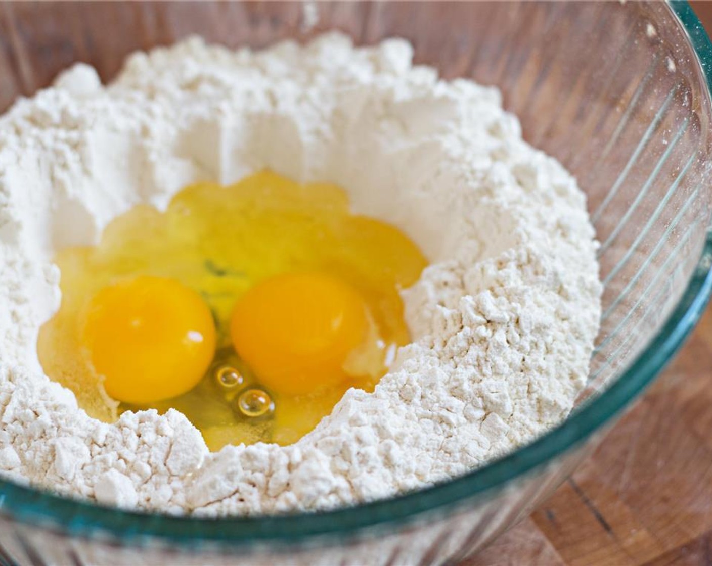 step 1 Put the All-Purpose Flour (3/4 cup) in a bowl. Make a crater in the center of the flour and crack the Egg (1) into it.