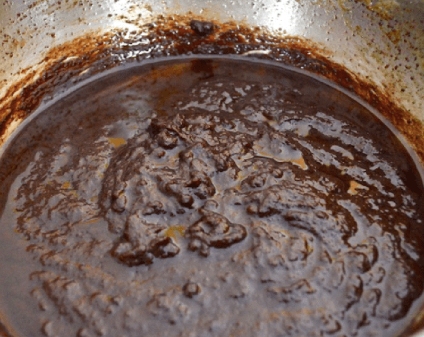 step 3 Then return the egg mixture back into the pan, along with the Unsweetened Cocoa Powder (1 Tbsp) and Godiva® Chocolate Liqueur (1/4 tsp).  Stir it constantly until it cooks through and thickens for about 5 minutes. Stir in the Dark Chocolate Chips (1 cup) until they melt in.