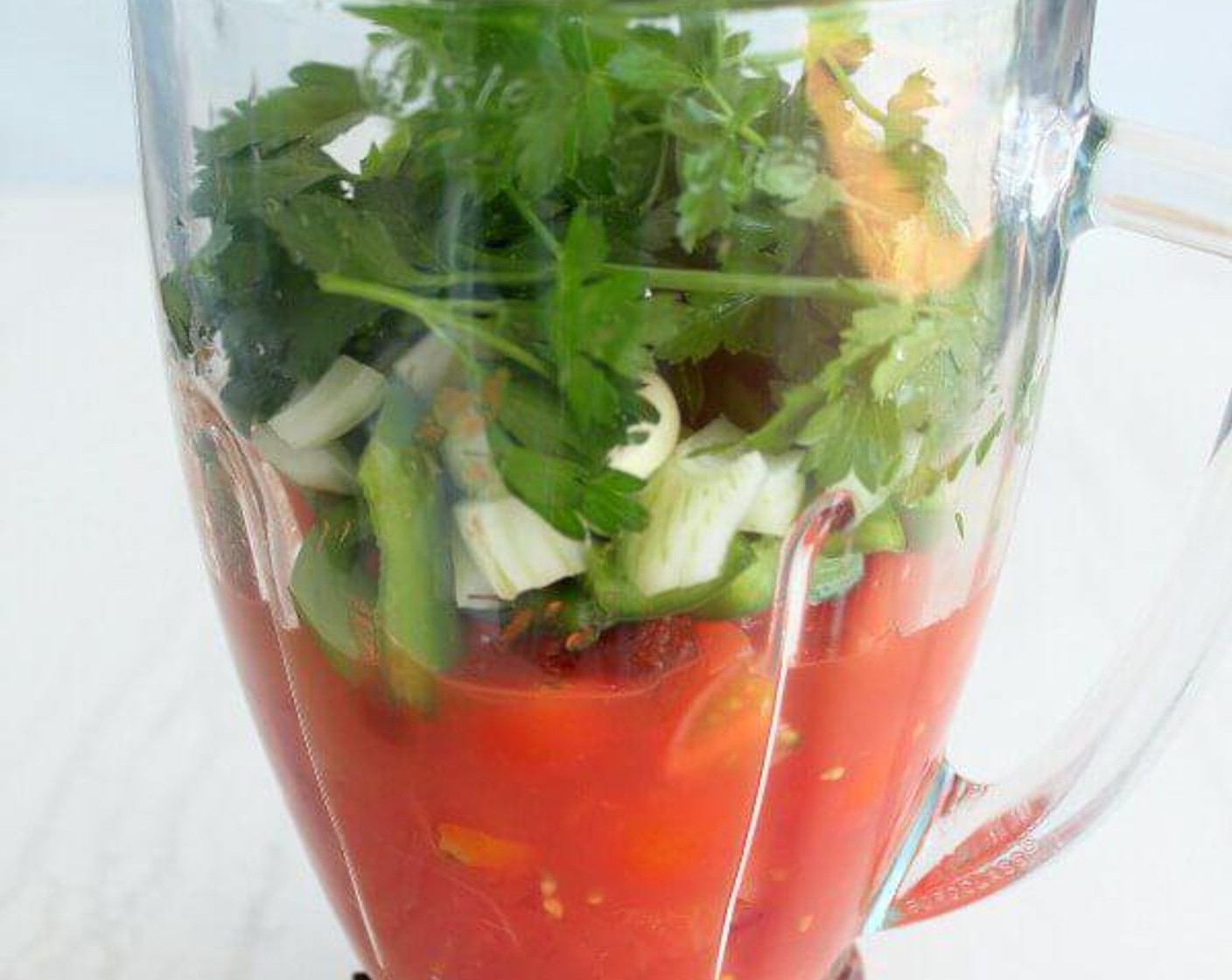 step 1 Place Canned Whole Peeled Plum Tomatoes (1 1/2 cups), Cherry Tomatoes (10), Tomato Paste (3 Tbsp), juice from Lemon (1), White Onion (1/2), Green Bell Pepper (1/2), Fresh Parsley (1 handful), and Garlic (2 cloves).