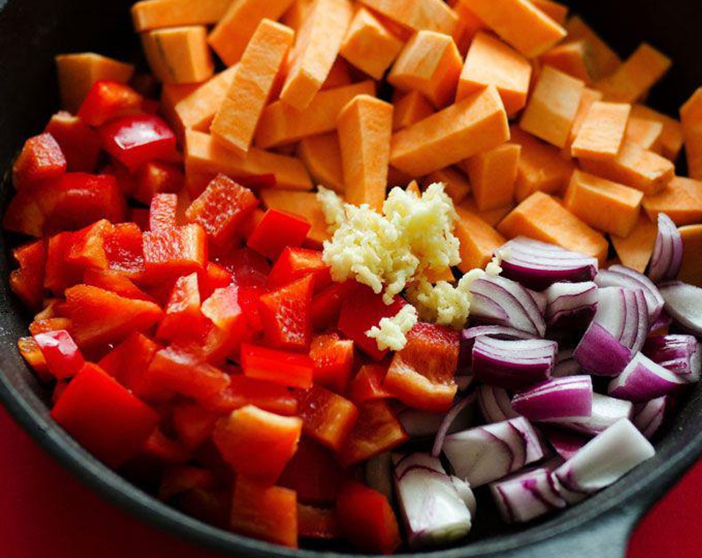 step 1 Heat Olive Oil (1 Tbsp) in a large skillet over medium heat. Add Sweet Potato (1), Shallots (2), Red Bell Pepper (1), and Garlic (2 cloves), tossing to coat. Cover and cook for 10 minutes, or until potatoes are soft.