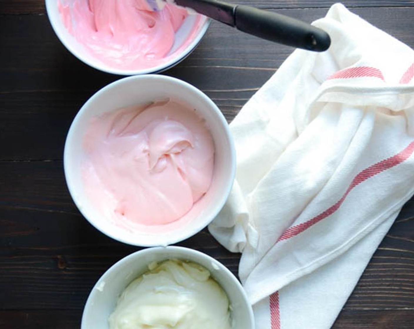 step 12 Divide the remaining frosting equally into 3 small bowls. Set aside one bowl of frosting with no food coloring added. Add 1 drop of Red Food Coloring (1 dash) to the second bowl. Add three drops of food coloring to the third bowl. Mix each bowl well so that you have gradually darkening colors