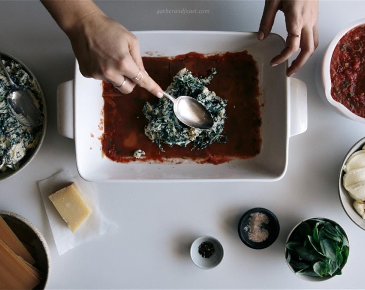 step 7 Using a large baking dish, spread some of the tomato sauce onto the bottom of the dish, add one layer of Gluten-Free Lasagna Sheets (14 oz) then spread a layer of the greens and ricotta mix, some basil leaves and another layer of pasta sheets.