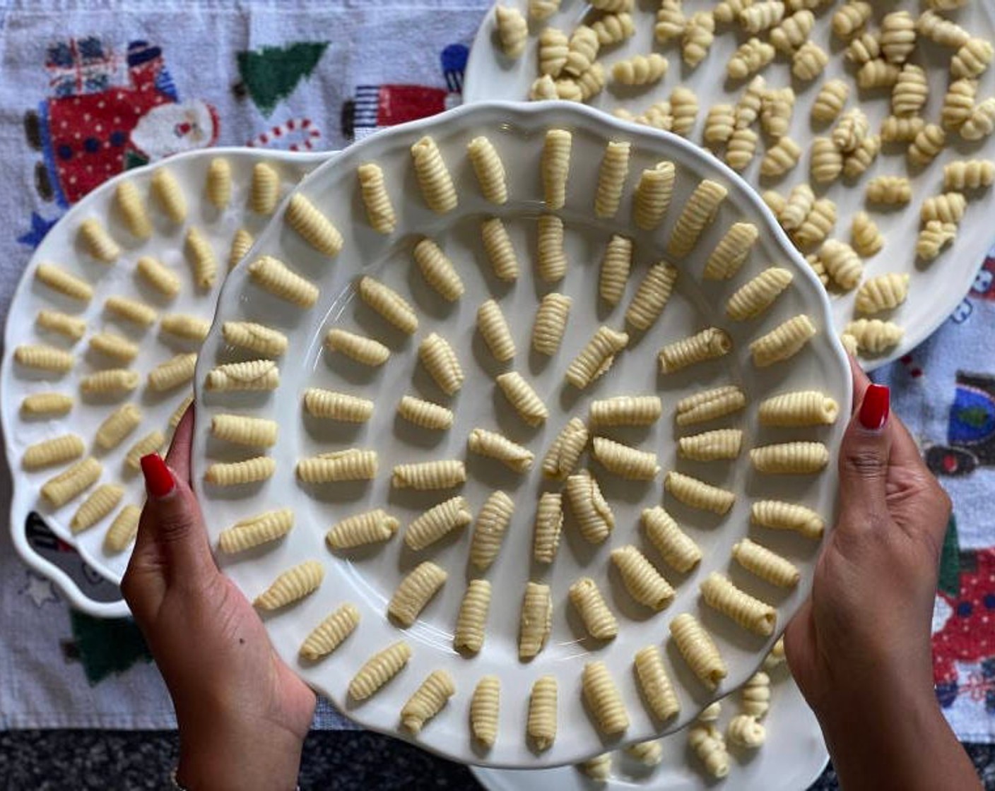 step 7 Place curls onto the oiled baking tray or plates. Repeat with the rest of the dough until all the dough has been used. You may need to oil your gnocchi board or fork so the dough doesn’t stick. Once all the dough has been shaped into curls, it's time to fry.