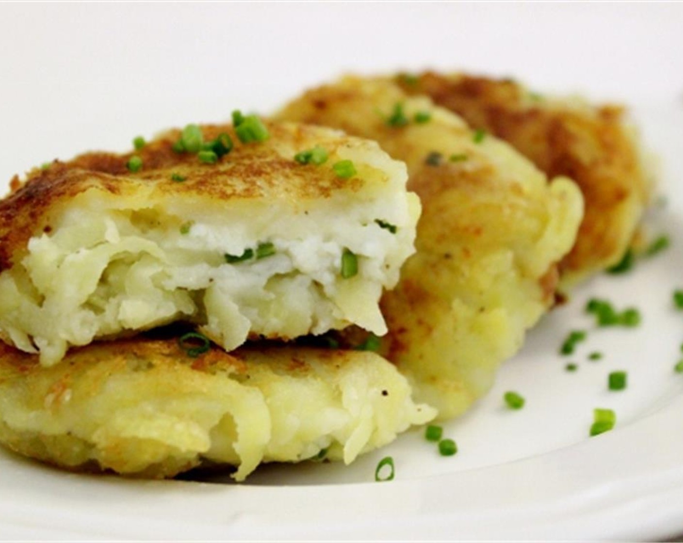 step 8 Drain the potato cakes on paper towels. Serve warm and enjoy!