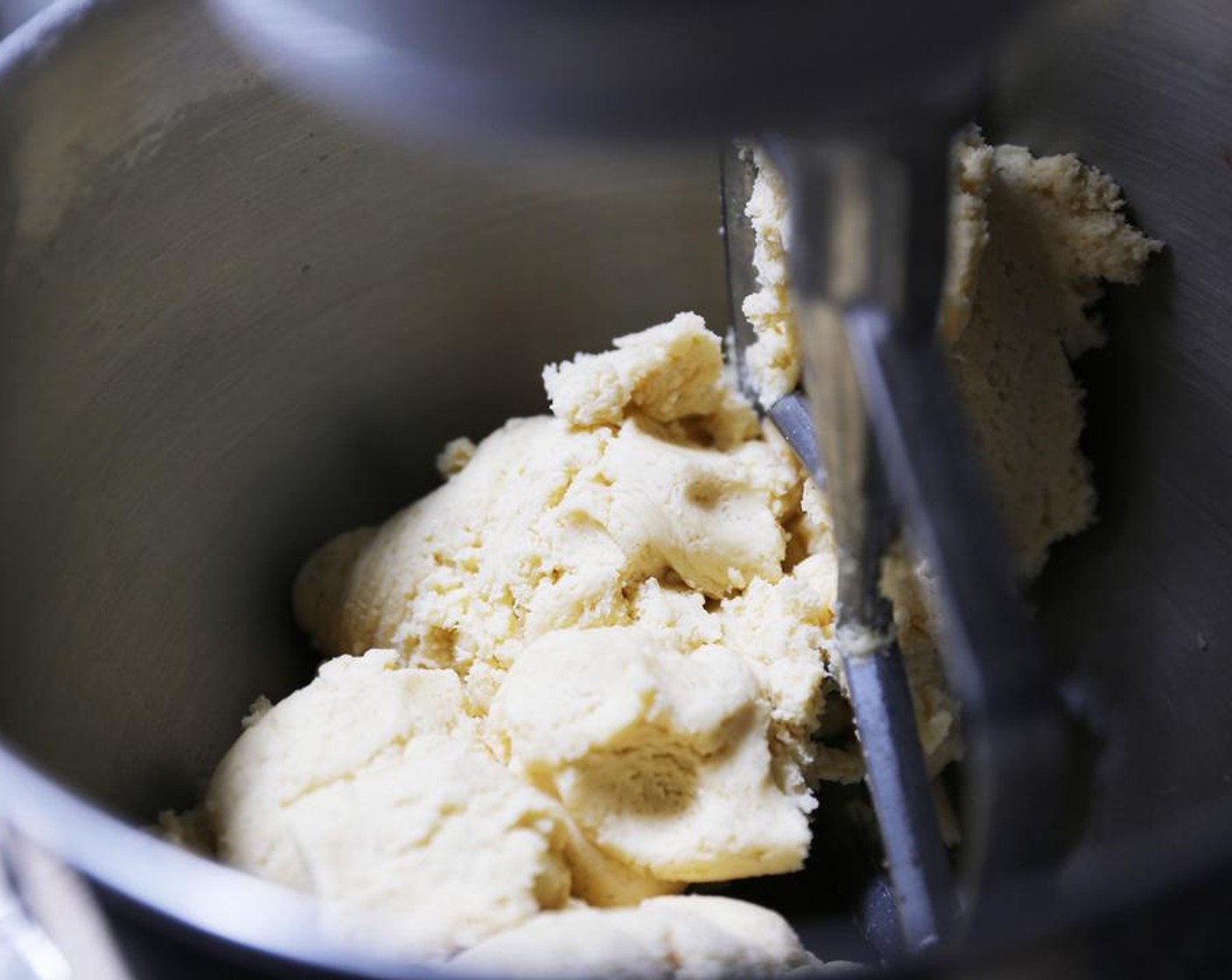 step 4 Add the Baking Powder (1/2 Tbsp), Salt (1/4 tsp) and All-Purpose Flour (3 cups) and mix on a medium-low speed until the mixture forms a dough.