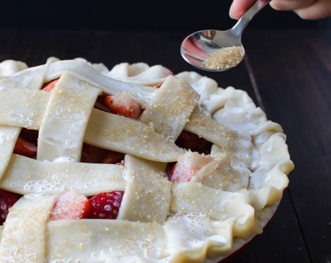 step 6 Place the pie on a baking sheet covered with aluminum foil to catch any spills. Bake for 20 minutes at 400 degrees F (200 degrees C).