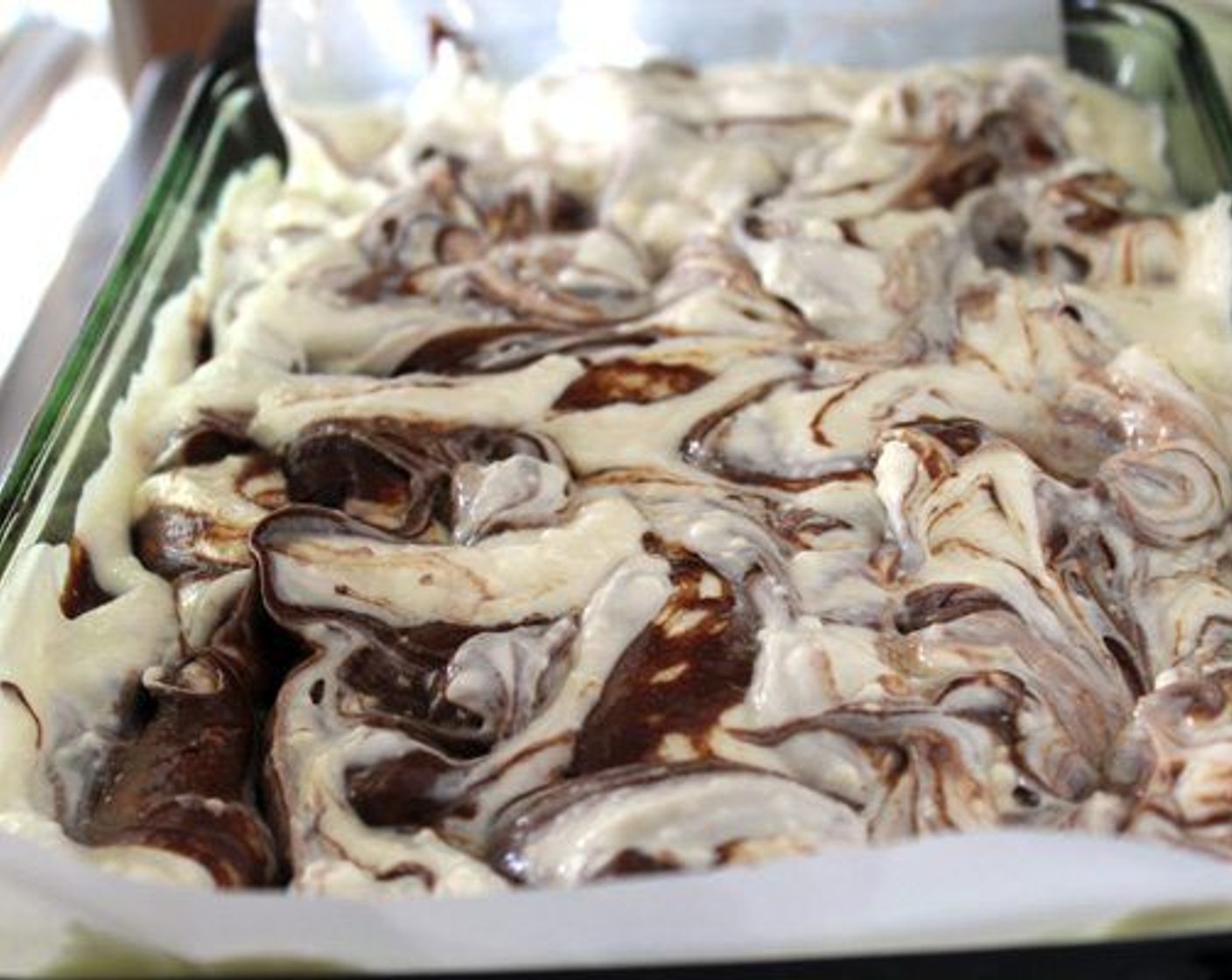 step 8 Let the brownies cool completely in the pan. Carefully lift them out with the parchment paper. Cut into squares.