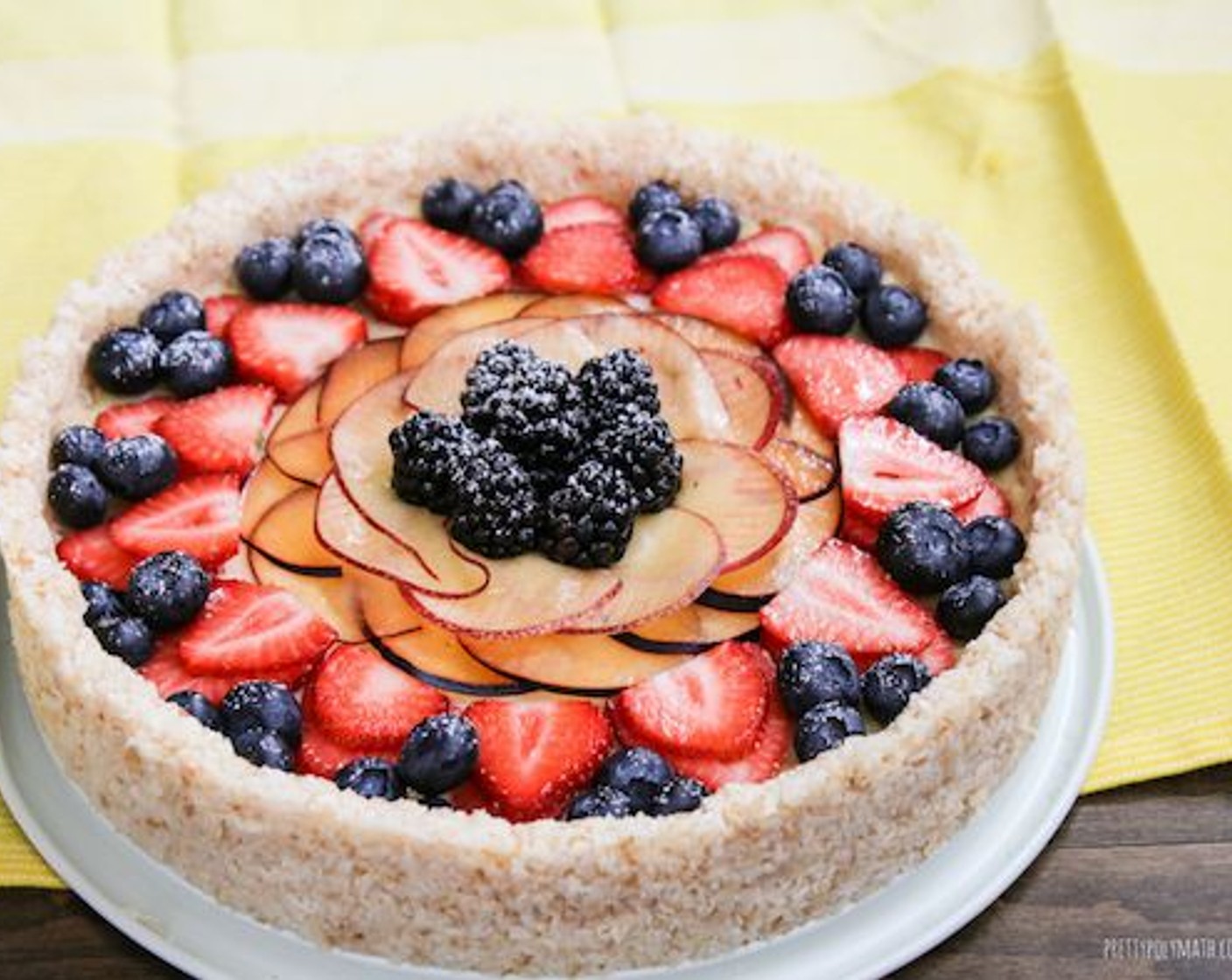 step 10 Pour the cream into the coconut crust and smooth out. Decorate with Fresh Mixed Berries (to taste). Refrigerate until ready to serve!