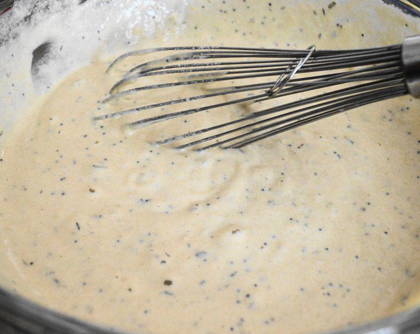 step 3 In another bowl combine the zest and juice of the Lemons (2), Almond Milk (1 cup), Olive Oil (2 Tbsp), Eggs (2), and Fresh Thyme Leaves (2 sprigs). Whisk those wet ingredients together until smooth. Pour the wet ingredients into the bowl of dry ingredients and whisk it all together into a smooth, thick batter.