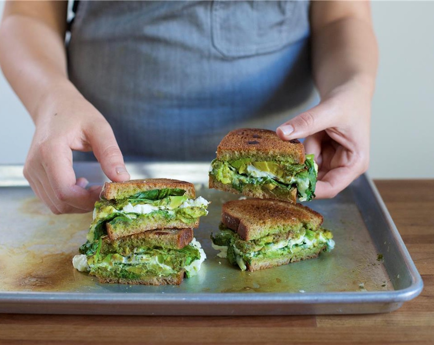 step 10 Cut the sandwiches in half and arrange on two plates. Place the cannelloni bean salad in a small bowl on the side.