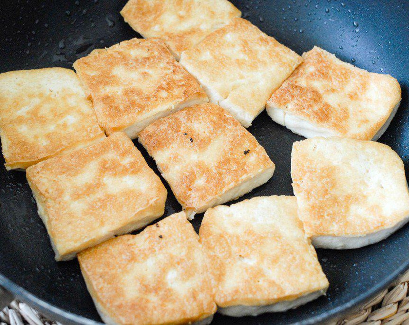 step 2 Add oil of choice in hot pan, then add in tofu, cook under medium heat until both sides are golden. (Each side take about 5-7 minutes)