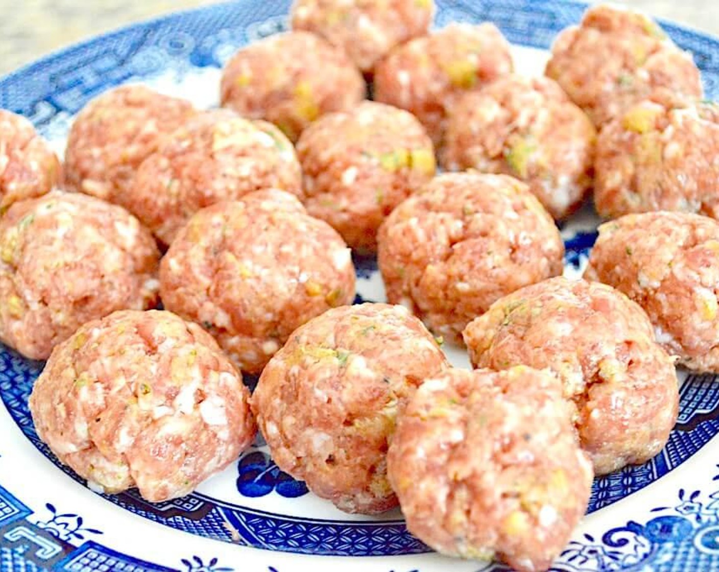 step 1 Combine the Ground Sweet Italian Sausage (1 lb), Seasoned Breadcrumbs (1/4 cup), Egg (1), Fresh Sage (1 Tbsp), Garlic (2 cloves), Salt (1 pinch), and Freshly Ground Black Pepper (1 pinch) in a bowl and mix it all together well with your clean hands. Form the mixture into little meatballs about the size of the palm of your hand and lay them out on a plate.