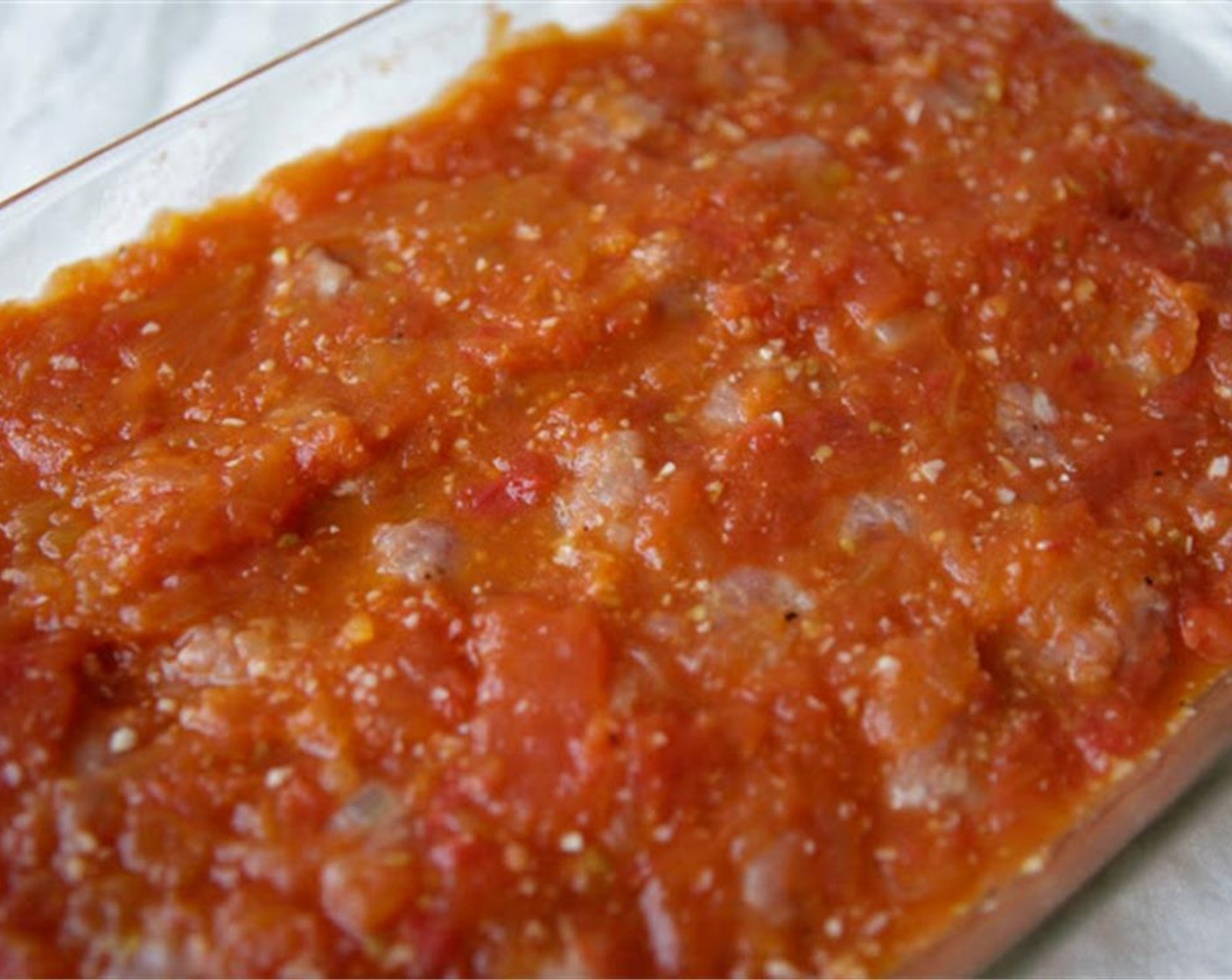 step 8 Place the meatballs in a baking dish. Pour over with tomato sauce and bake in the oven for 30 minutes.