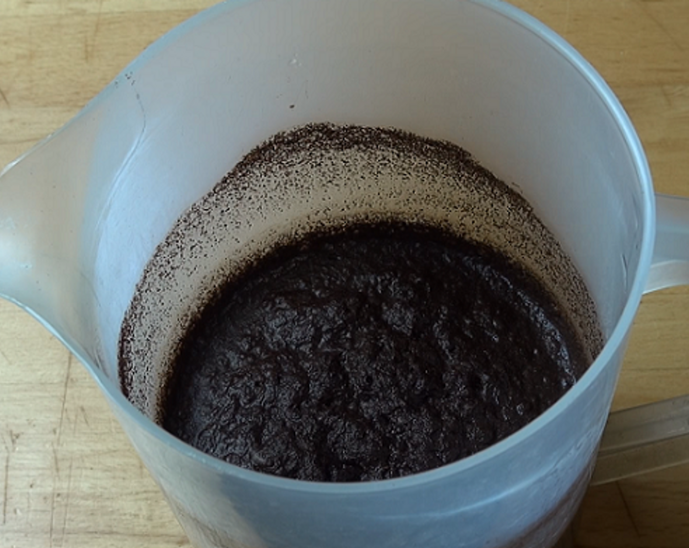 step 1 In a large jug, mix together Ground Coffee (2 cups) and Cold Water (3 1/2 cups). Cover with plastic wrap and let sit at room temperature for 12 hours.