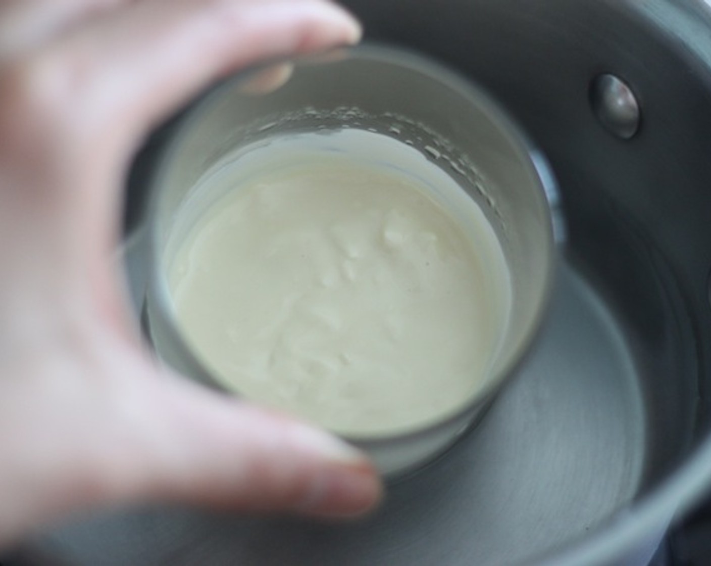 step 17 Prepare White Chocolate (3 Tbsp) and a piping bag. Then set a half-fill saucepan with water and bring to a simmer. Place a cup on top, making sure it doesn’t touch water (or it will overheat). Stir with a metal spoon until melted.