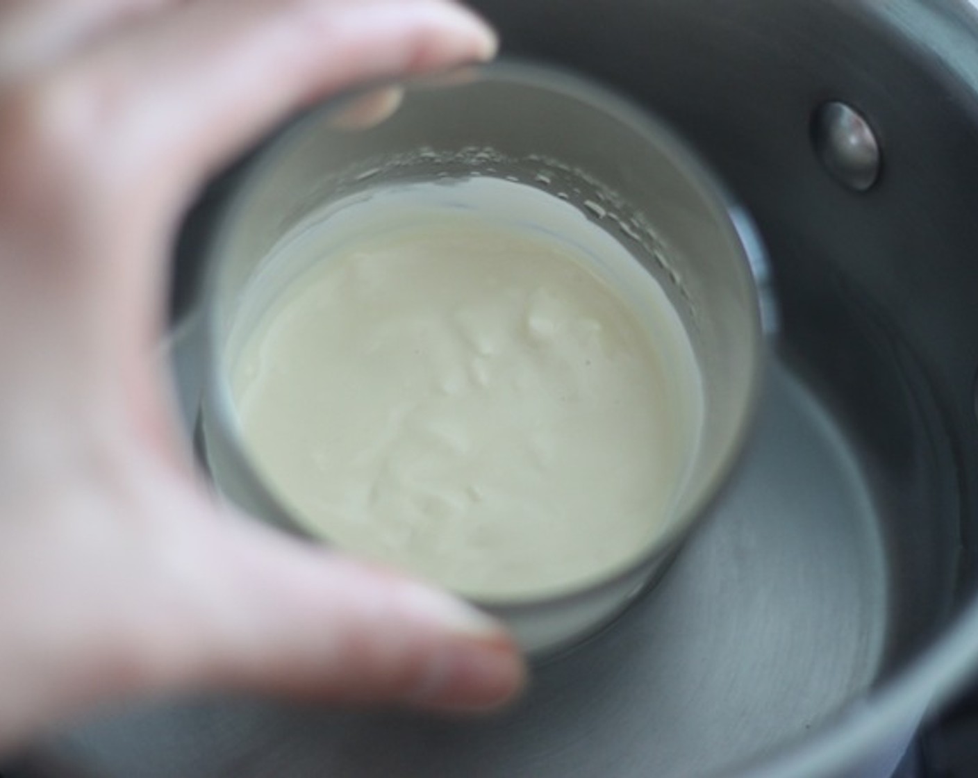 step 17 Prepare White Chocolate (2 2/3 Tbsp) and a piping bag. Then set a half-fill saucepan with water and bring to a simmer. Place a cup on top, making sure it doesn’t touch water (or it will overheat). Stir with a metal spoon until melted.