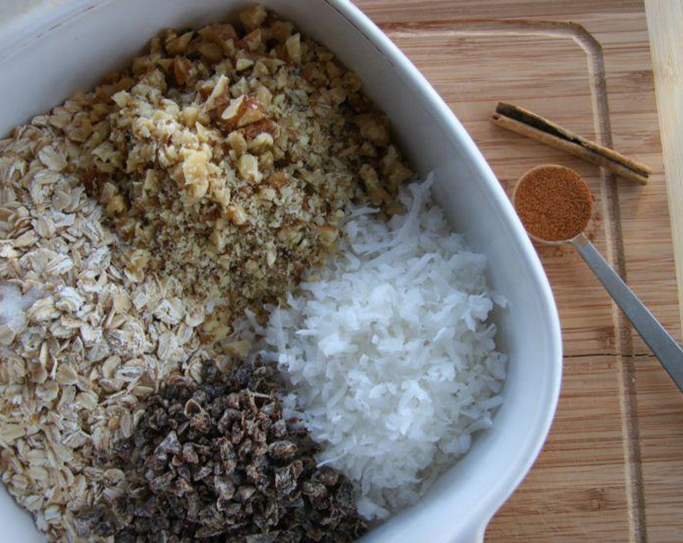 step 2 Combine Oats (2 cups), Chopped Nuts (1 cup), Unsweetened Shredded Coconut (1 cup), Dried Fruits (1 cup), Ground Cinnamon (1 tsp), and Salt (1/4 tsp) in a large bowl.