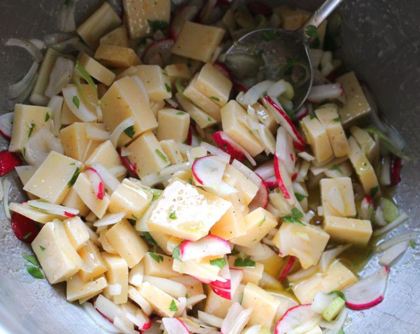 step 1 Dress the Gouda (2 cups), Onions (2), Scallion (1 bunch), and Radish (1 bunch) with a generous splash of Vinaigrette (to taste). Marinate for around an hour.