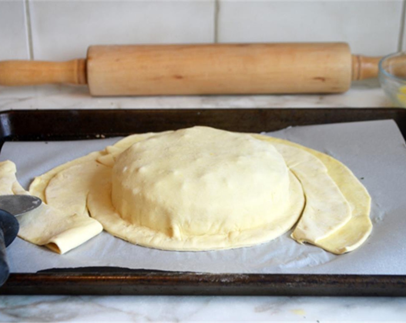 step 6 Trim the pastry, leaving a 1-inch border around the cheese.