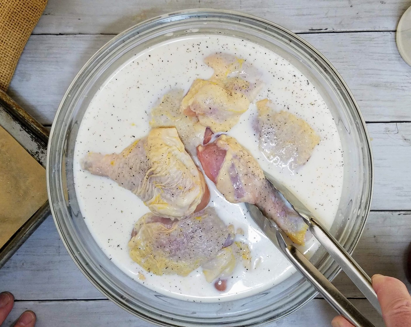 step 2 Then, in a large bowl, make a milk bath by combining Milk (4 cups) with Hot Sauce (1 Tbsp). Put the chicken into the milk bath and marinate for at least 2 hours or overnight.