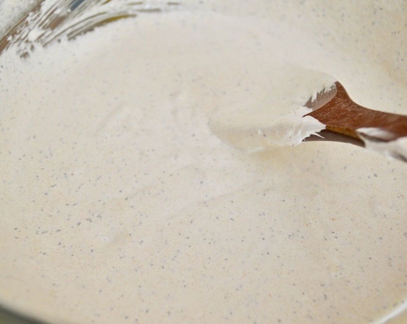 step 8 Take the meringue and fold it in thoroughly with the paste in the mixing bowl. You will need to mash it together a little to break up the paste into the meringue. It should become a smooth, shiny, and pretty mixture with the flecks of tea leaves.