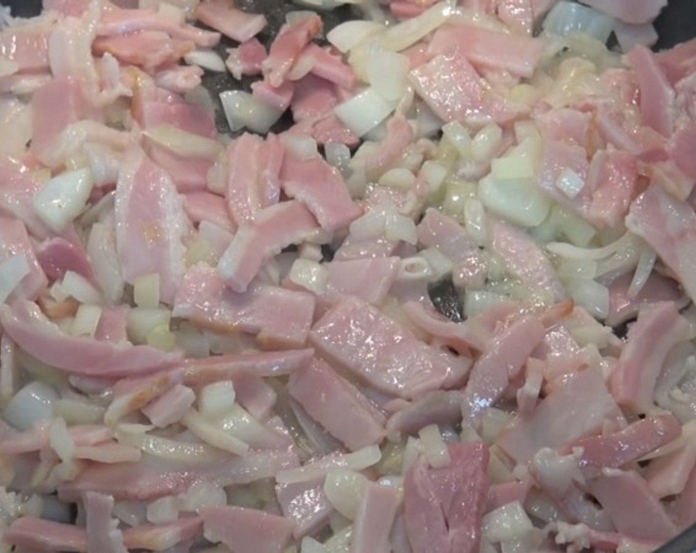 step 7 In a fry pan over medium heat, allow Butter (2 Tbsp) to melt. Add Yellow Onion (1) and Bacon (6 slices). Fry until onions have softened and bacon is lightly browned. Transfer to a bowl and allow to cool.