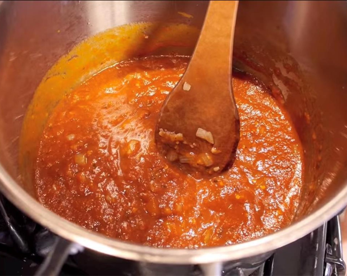 step 5 Add tomato mixture to onions, turn up heat, and let reduce by half. Season with Salt (to taste) and Ground Black Pepper (to taste).