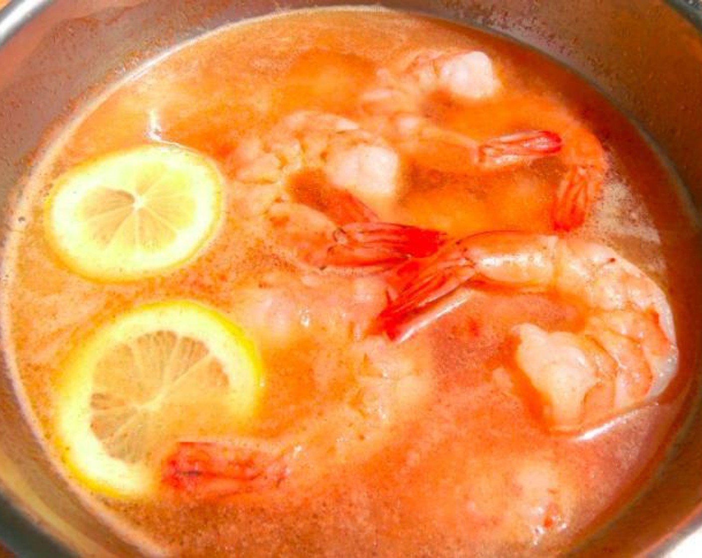 step 1 Simmer Shrimp (2 lb) in salted water, with Lemon (1), Butter (1/2 cup), Garlic Paste (1 Tbsp) and Sriracha (1 tsp) until half-way cooked (the shrimp will finish cooking while steeping with the other seafood).