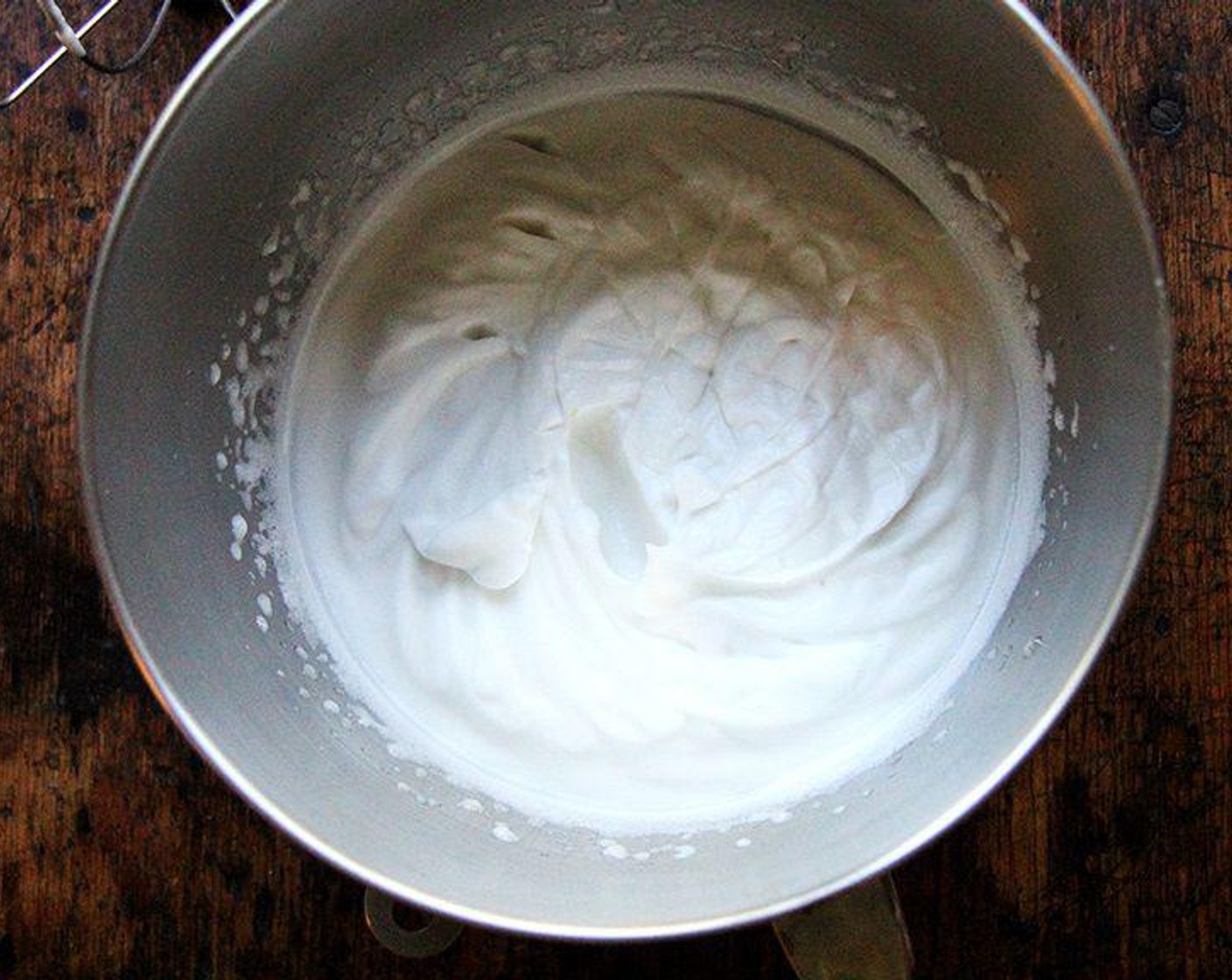 step 1 Drain the Canned Chickpeas (2 cups) and put 200 milliliter of the chickpea water in the bowl of a standard mixer. Add Cream of Tartar (1/4 tsp), Salt (1/4 tsp), Powdered Confectioners Sugar (1/4 cup). Beat on medium high speed for 15 minutes. After this, the liquid should have tripled in volume, and it should be able to hold stiff peaks.