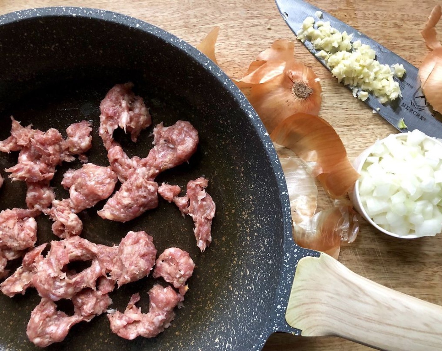 step 3 Meanwhile, in a large nonstick skillet heat the remaining Olive Oil (1 tsp) over medium heat. Add Mild Italian Sausages (8 oz) with casing removed, Onion (1/2 cup), and Garlic (2 cloves). Cook about 10 minutes or until sausage is browned and onion is tender, stirring to break sausage apart.