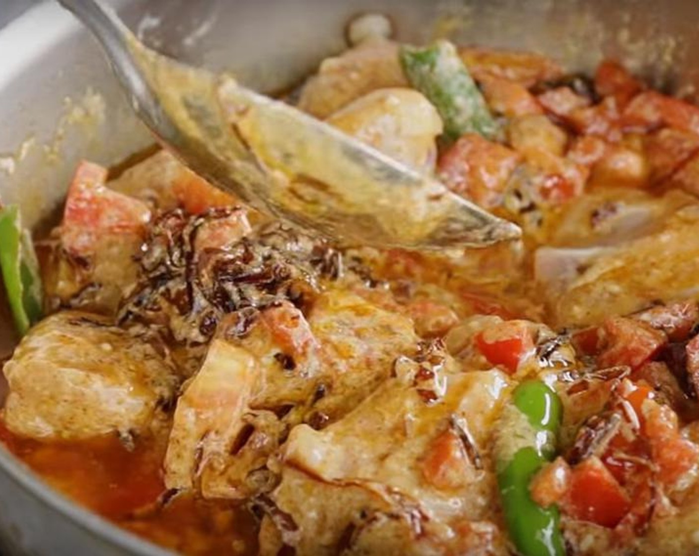 step 2 Add Ginger Garlic Paste (2 Tbsp) and saute for another thirty seconds. Add the Chili Powder (2 tsp), Ground Coriander (2 tsp), Plum Tomatoes (4), Whole Chickens (2 lb), Salt (to taste), Green Chili Peppers (2) and Plain Yogurt (1 cup). Cook till chicken is done, for 20 to 25 minutes, stir occasionally. Reserve a tablespoon of the oil that's on the surface. Mix in the Fresh Cilantro (to taste) turn off the heat and set aside while you get the rice ready.