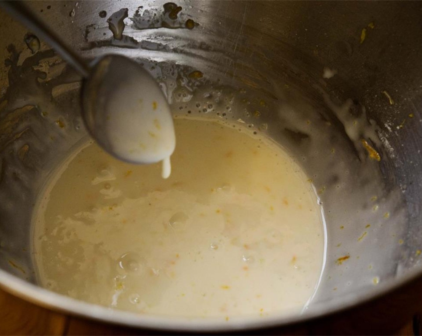 step 8 Prepare the icing by combining Powdered Confectioners Sugar (2 cups), the remaining Lemon Zest, 1/2 tsp Lemon Juice, 1/2 Tbsp Orange Zest, 1/2 Tbsp Orange Juice, Milk (1 Tbsp), and Egg White together. Whisk until you get a pourable consistency.