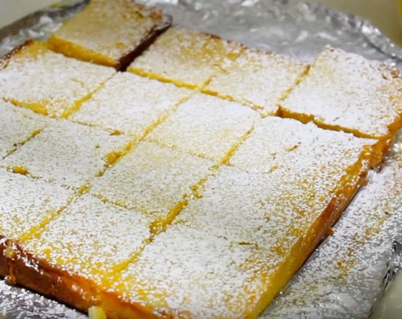 step 7 Slice into squares. Dust with Powdered Confectioners Sugar (to taste). Serve and enjoy!