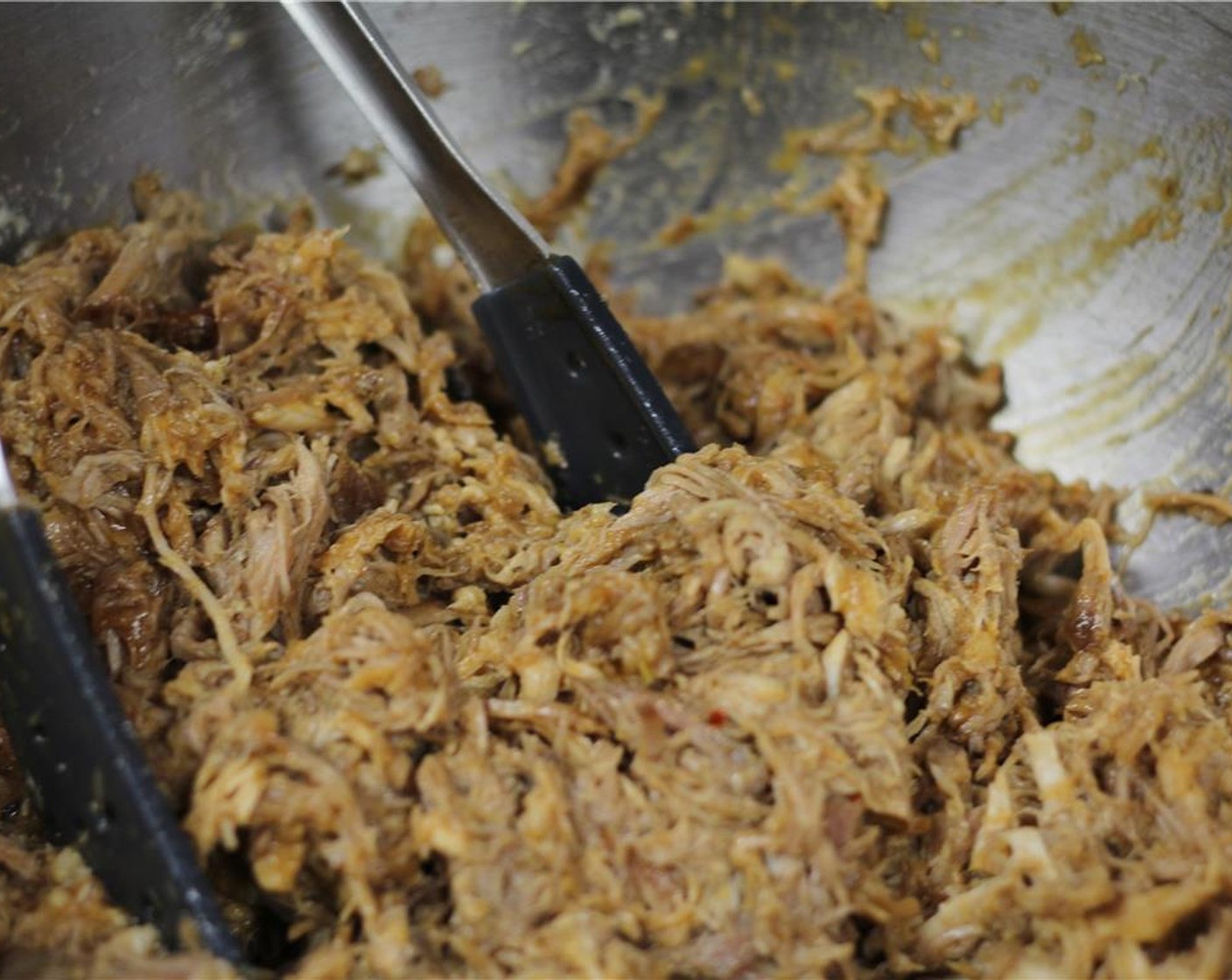 step 15 Shred the pork with two forks or with gloved hands. Toss with additional bbq sauce, if desired.