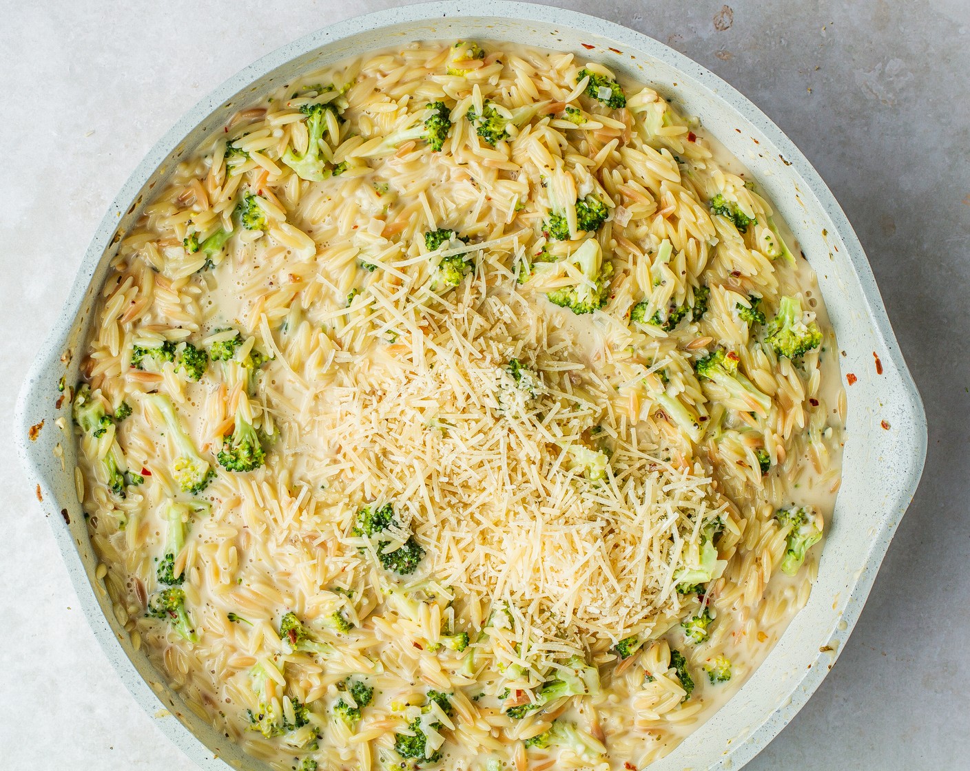 step 8 Remove the skillet from the heat and stir in the Shredded Parmesan Cheese (1 cup) until it melts.