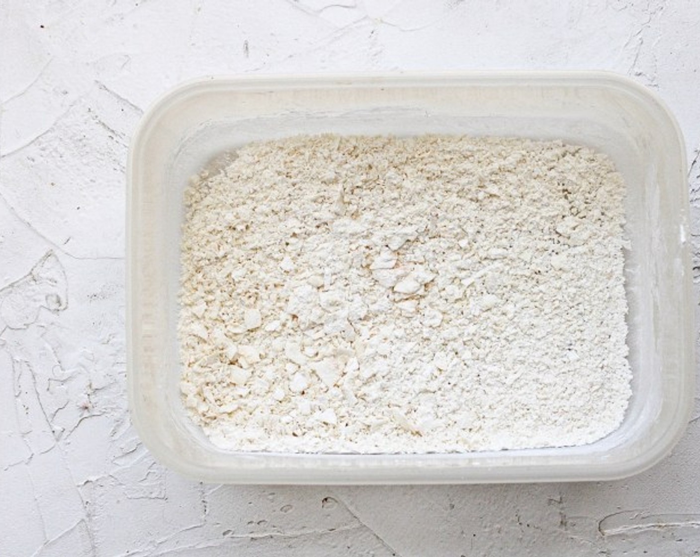 step 7 While the tofu is marinating, make your coconut crust. Combine the Unsweetened Shredded Coconut (1/2 cup), Panko Breadcrumbs (1/2 cup), and Corn Starch (1/4 cup) in a large bowl or Tupperware container with a lid.