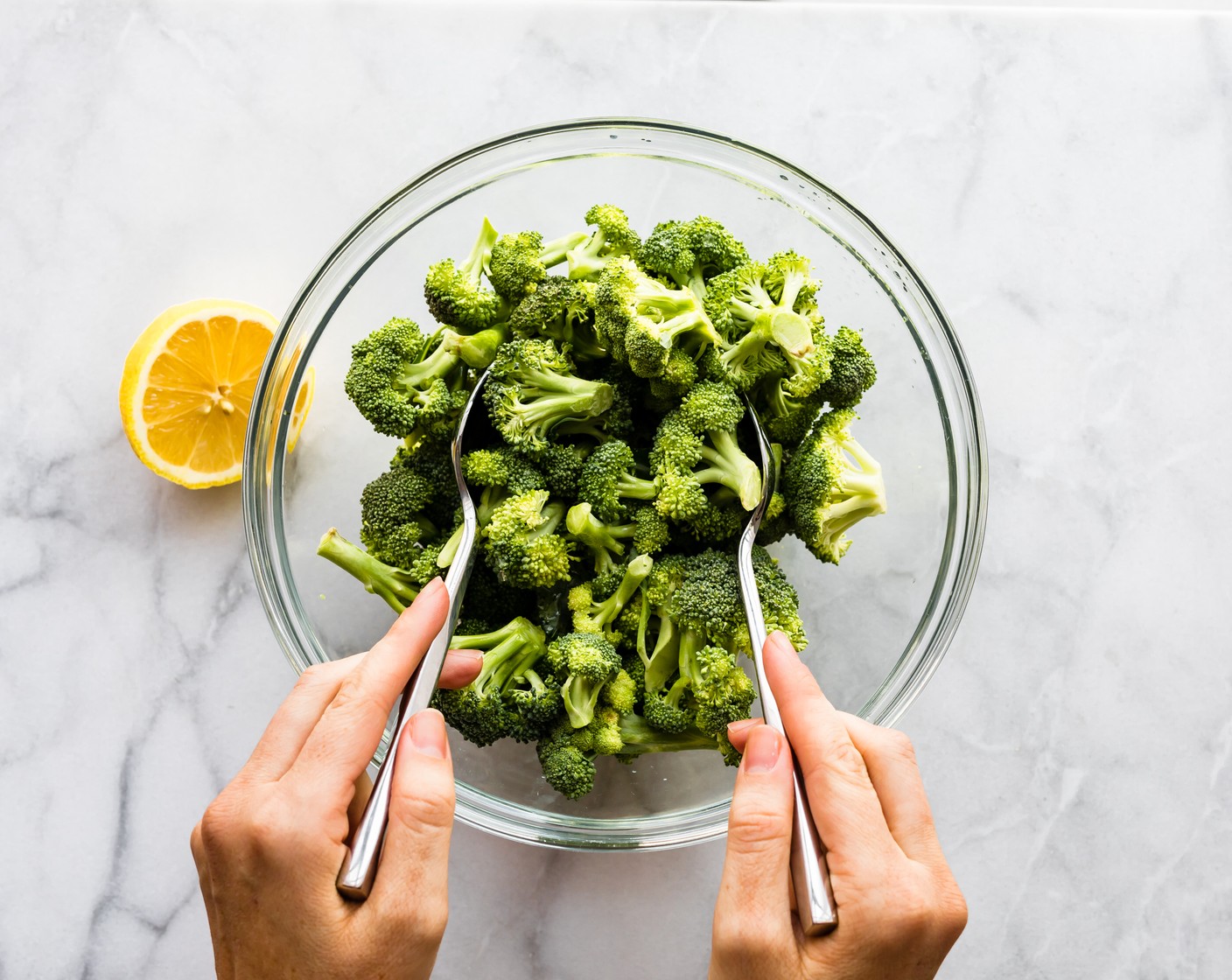 step 7 Next, toss the Broccoli Florets (3 cups) in Olive Oil (1 Tbsp), juice from Lemon (1), and remaining Kosher Salt (1/2 tsp) and Ground Black Pepper (1/2 tsp).