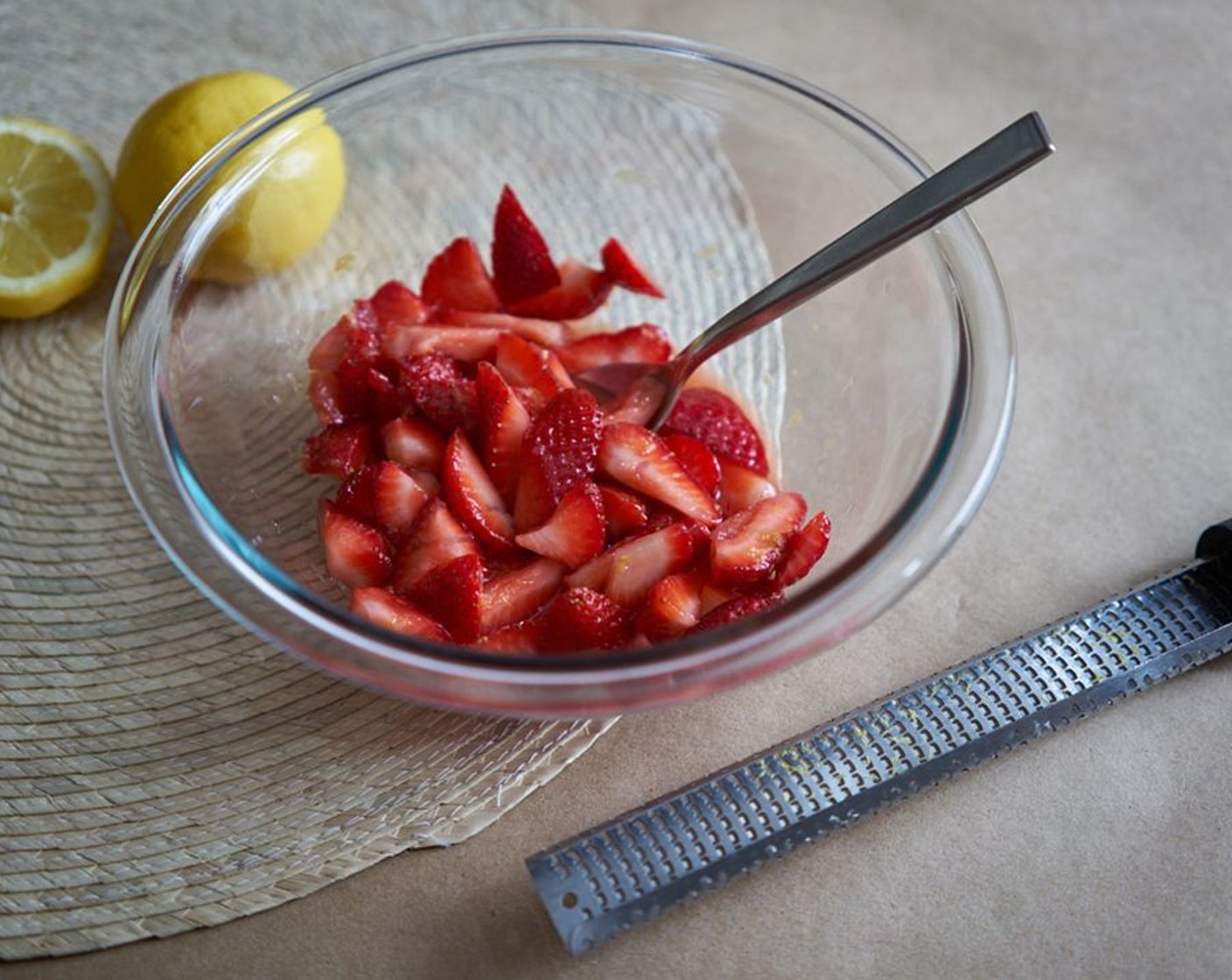 step 2 Add the zest, 2 Tbsp of juice from the Lemon (1), and Honey (1 Tbsp). Stir to combine and allow to macerate for 10 minutes, or until the juices are running from the strawberries.