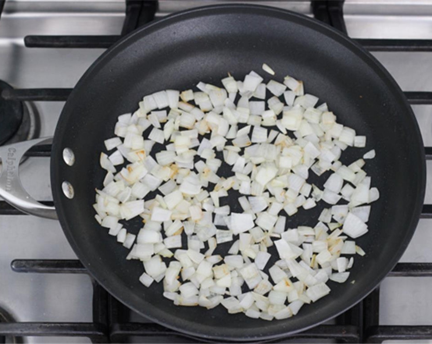 step 7 Set the cooked skinless chicken breastsaside and heat the remaining Canola Oil (1 Tbsp) in the pan. Cook the chopped onion until they start to turn golden brown.