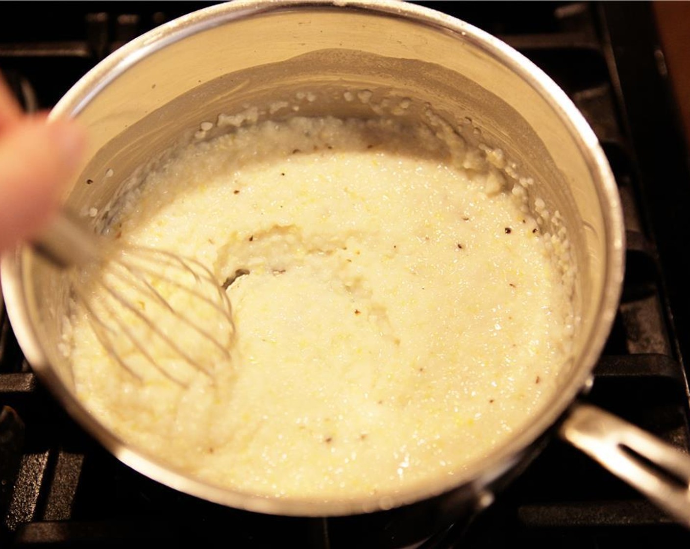 step 8 Add the Gouda (1/3 cup) and Butter (1 Tbsp) to the grits, stirring well to melt and combine, then adjust the consistency with a little more whole milk or water if needed.