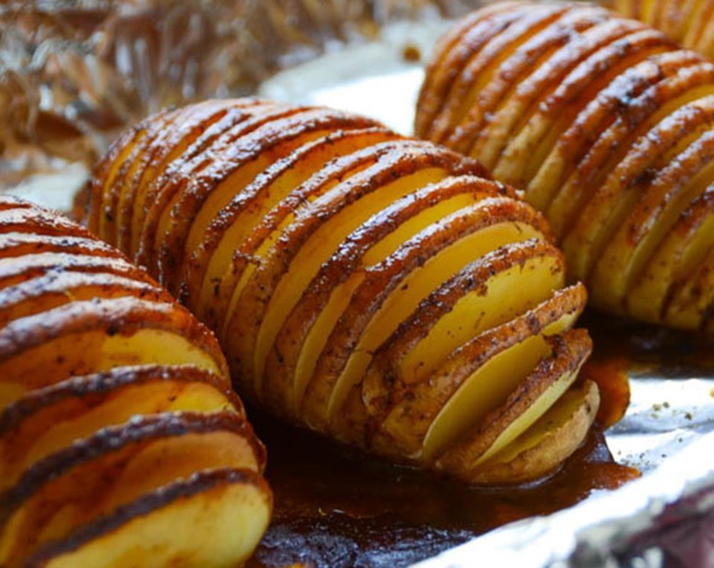 step 14 The potatoes cook for about an hour, so judge when to put them into the oven based on how long it will take for the chicken to cook. Place the potatoes on a baking sheet and bake for about 1 hour, basting with additional chipotle lime sauce occasionally.