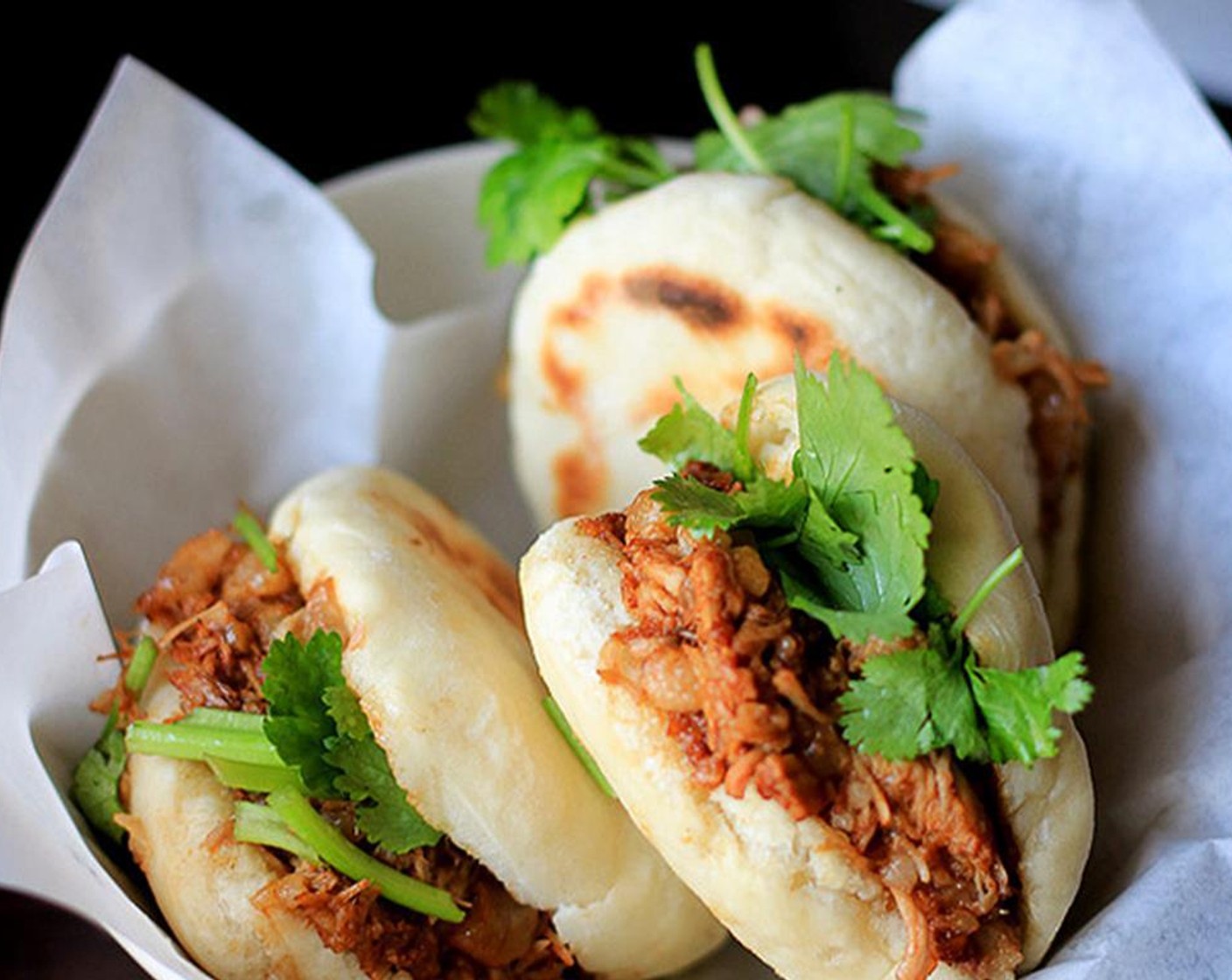 step 13 Cut 2/3 of the bun from the middle. Lay minced pork and other ingredients within the bun. Serve and enjoy!