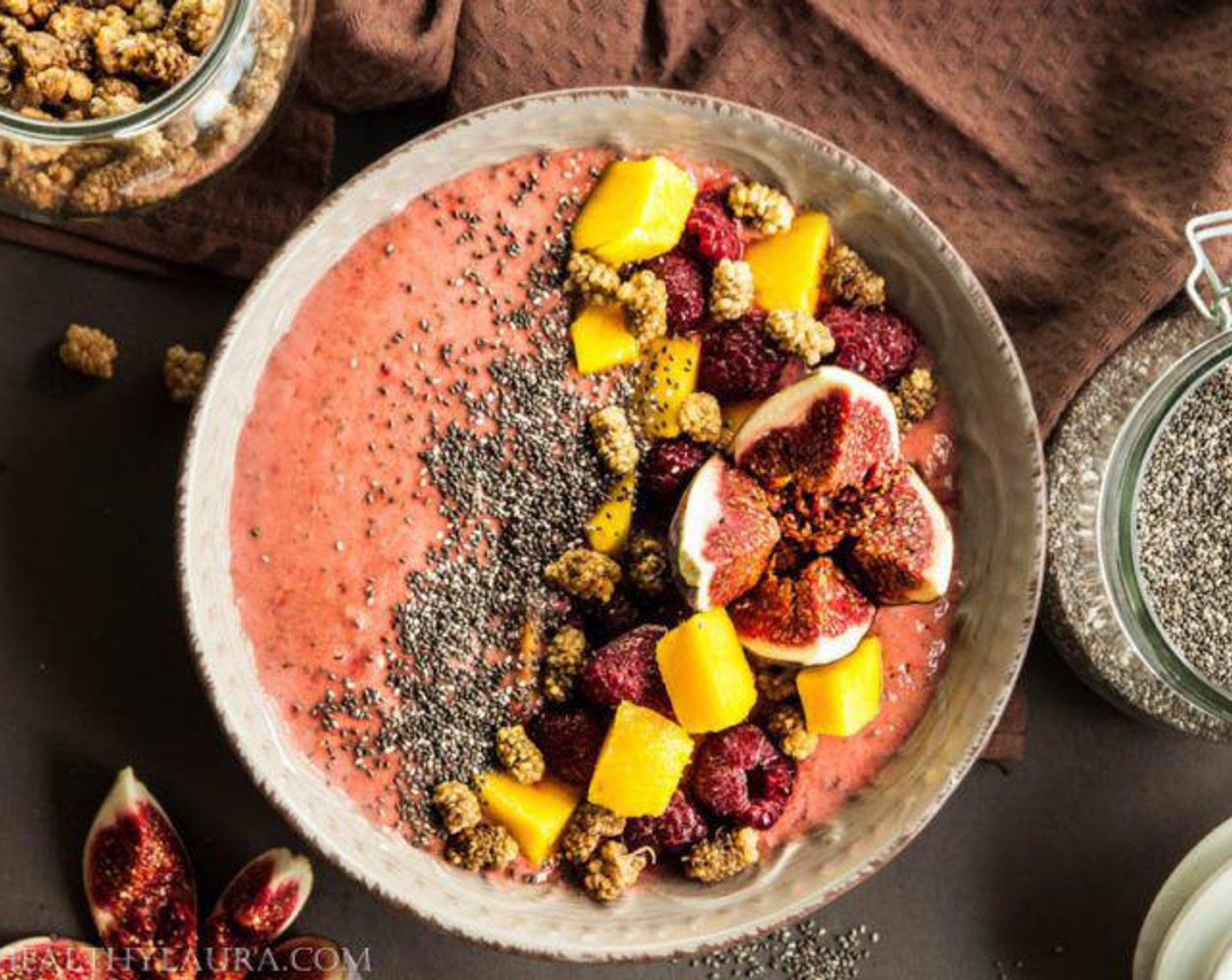 step 3 Pour the smoothie into a bowl and decorate with Mango (1/2), Fresh Raspberry (1 handful), Fig (1), and Dried Mulberries (1 handful). Serve and enjoy!