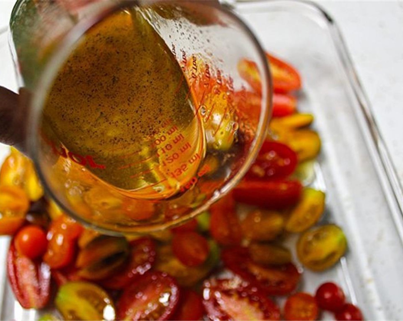 step 4 Pour honey mixture over cherry tomatoes, and stir to coat. Roast for 30 minutes in the oven, until golden, juicy, and bubbling.