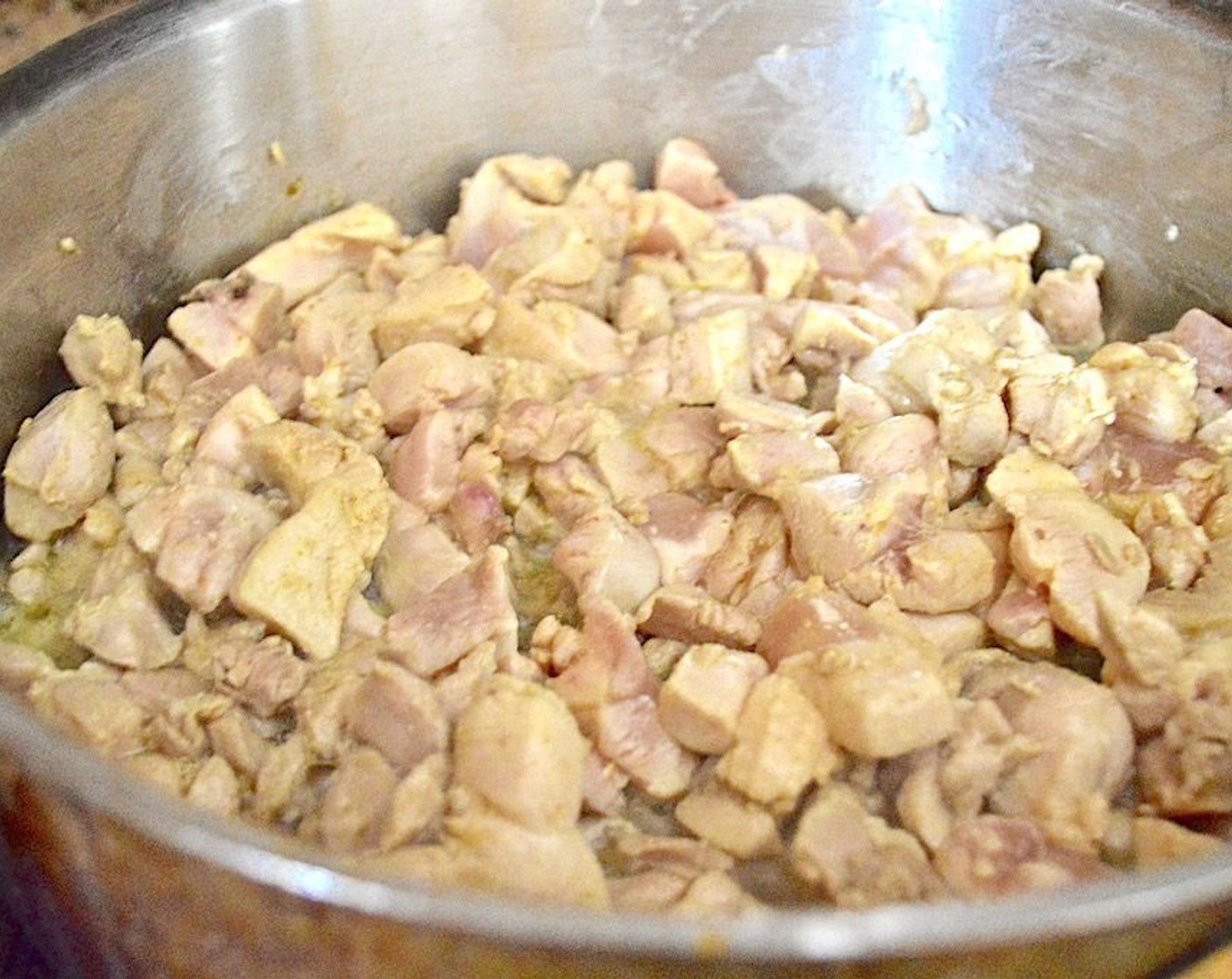 step 2 Season Boneless, Skinless Chicken Thighs (5) with a little bit of the Curry Powder (1/4 tsp) and Salt (1 pinch), then brown them in the pan for 3 to 4 minutes. It should get cooked through and just start to develop a little color on the outside, then transfer it to a plate.