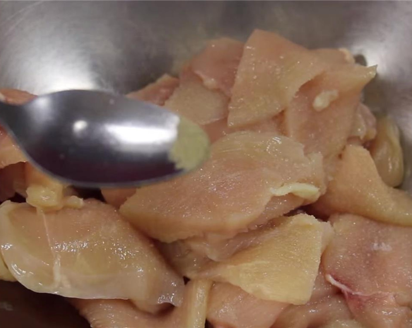 step 5 Add chicken to a bowl along with Salt (1/2 tsp), Ground White Pepper (1/8 tsp), Simply Organic Garlic Powder (1/4 tsp), Water (4 Tbsp) and mix.