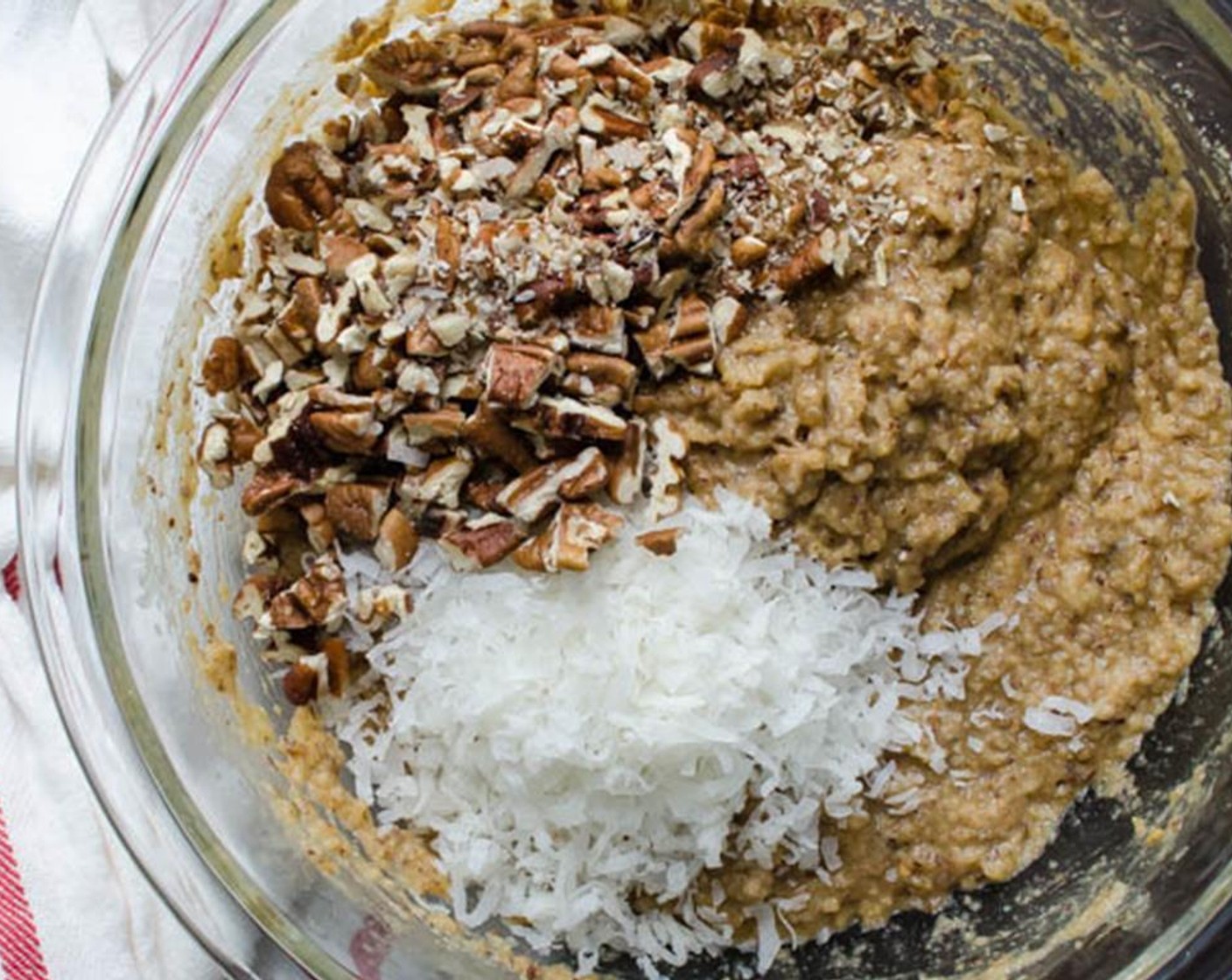 step 6 Add the pecans and Sweetened Coconut Flakes (1/2 cup) to the banana mixture and stir. Transfer the batter to the prepared loaf pan and sprinkle with the remaining 2 tablespoons of Chopped Pecans (2 Tbsp) and Pepitas (2 Tbsp) if desired.