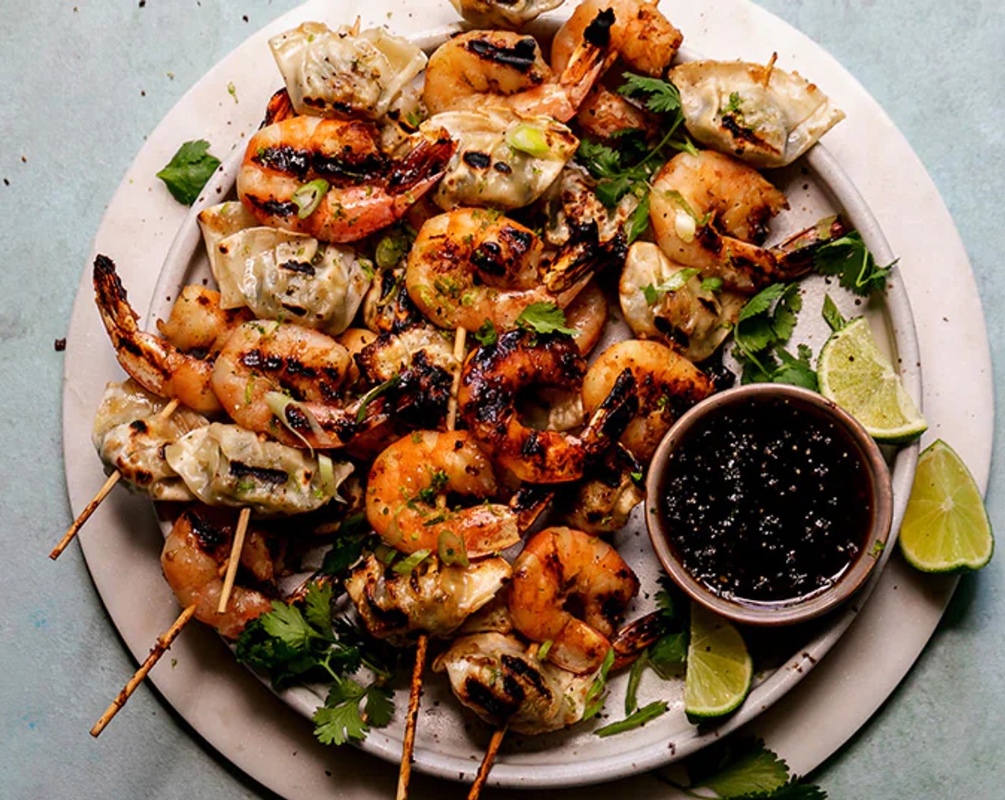 step 6 To serve, garnish with Fresh Cilantro (as needed), Scallions (as needed) and lime zest. Serve with extra sauce for dipping, if desired.